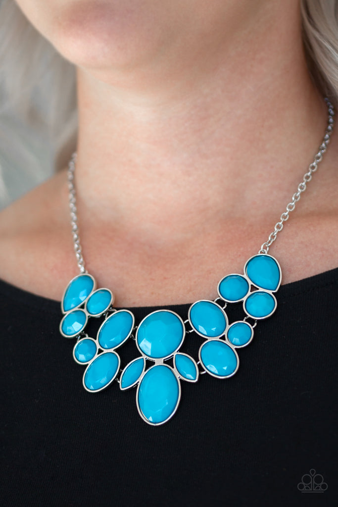 Featuring round, teardrop, and oval shapes, a collection of faceted blue beads are pressed into sleek silver frames. The colorful frames link below the collar, creating a vibrant fashion. Features an adjustable clasp closure.  Sold as one individual necklace. Includes one pair of matching earrings.