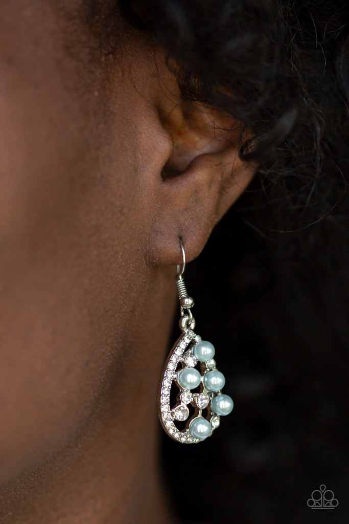 Glassy white rhinestones and pearly blue beads are sprinkled along the center of a rhinestone encrusted teardrop for a glamorous look. Earring attaches to a standard fishhook fitting.  Sold as one pair of earrings.