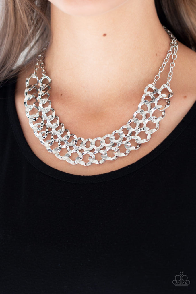 Asymmetrical silver frames connect below the collar, creating a bold web-like fringe for a statement-making look. Features an adjustable clasp closure.  Sold as one individual necklace. Includes one pair of matching earrings.