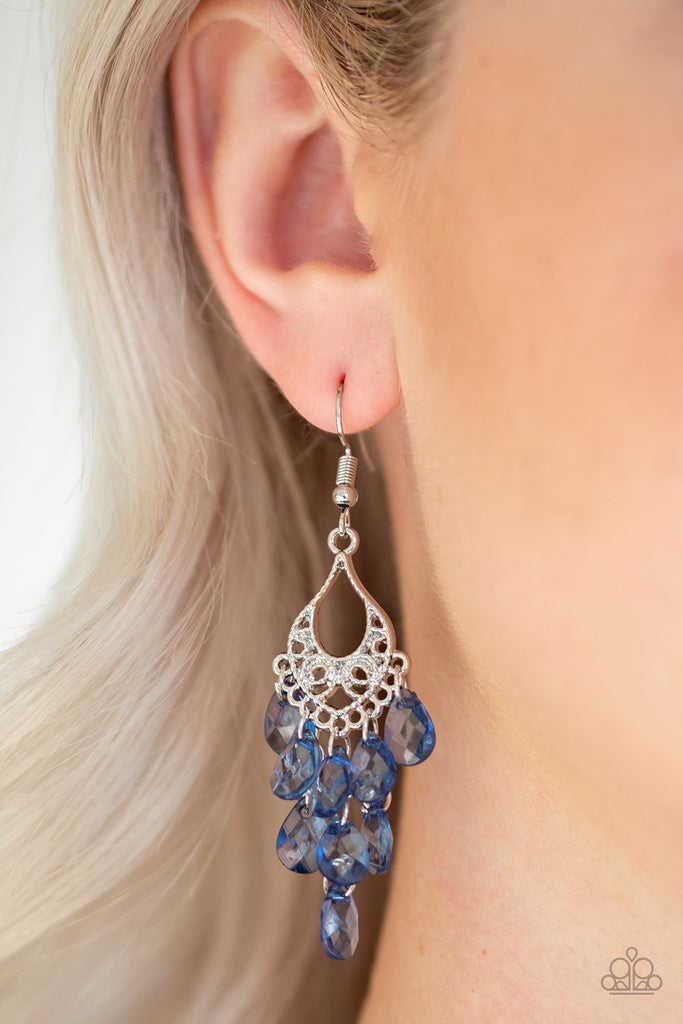 Glassy blue teardrops cascade from the bottom of an ornate silver frame, coalescing into a whimsical chandelier. Earring attaches to a standard fishhook fitting.  Sold as one pair of earrings.