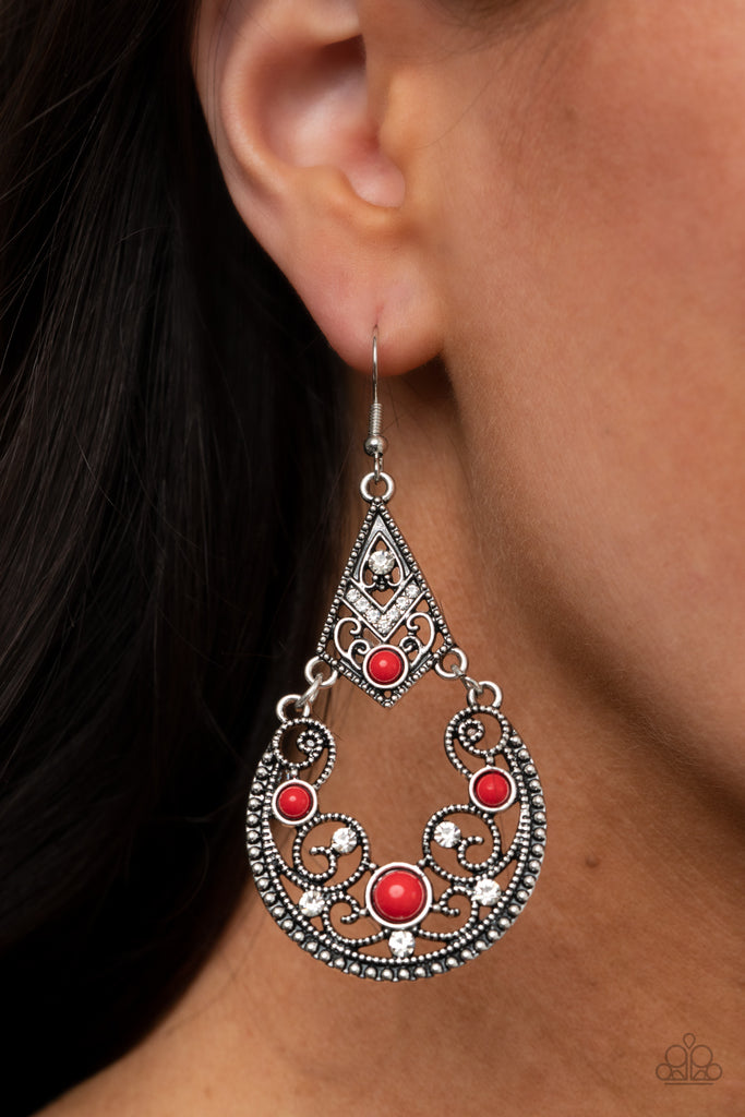 Encrusted with glassy white rhinestones, studded filigree filled frames are dotted with bubbly red beads as they whimsically link into an enchanting lure. Earring attaches to a standard fishhook fitting.  Sold as one pair of earrings.