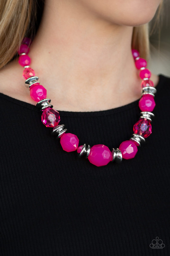 Infused with shimmery silver accents, faceted pink beads gradually increase in size as they join below the collar for a vivacious springtime look. Features an adjustable clasp closure.  Sold as one individual necklace. Includes one pair of matching earrings.