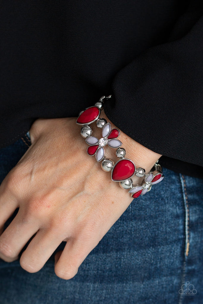 Featuring wine and Paloma beaded petals, white rhinestone dotted floral frames, shiny silver beads, and faceted wine teardrop beads are threaded along stretchy bands around the wrist for a glamorous look.  Sold as one individual bracelet.