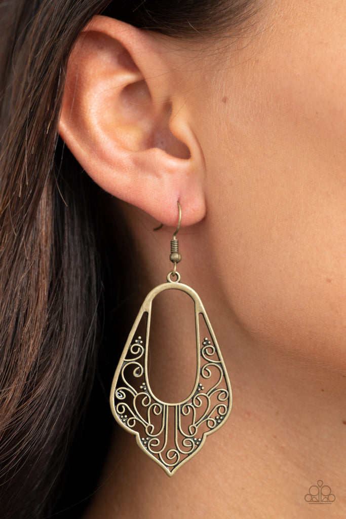 Brass vine-like filigree climbs the bottom of a scalloped brass frame, coalescing into a vintage inspired look. Earring attaches to a standard fishhook fitting.  Sold as one pair of earrings.