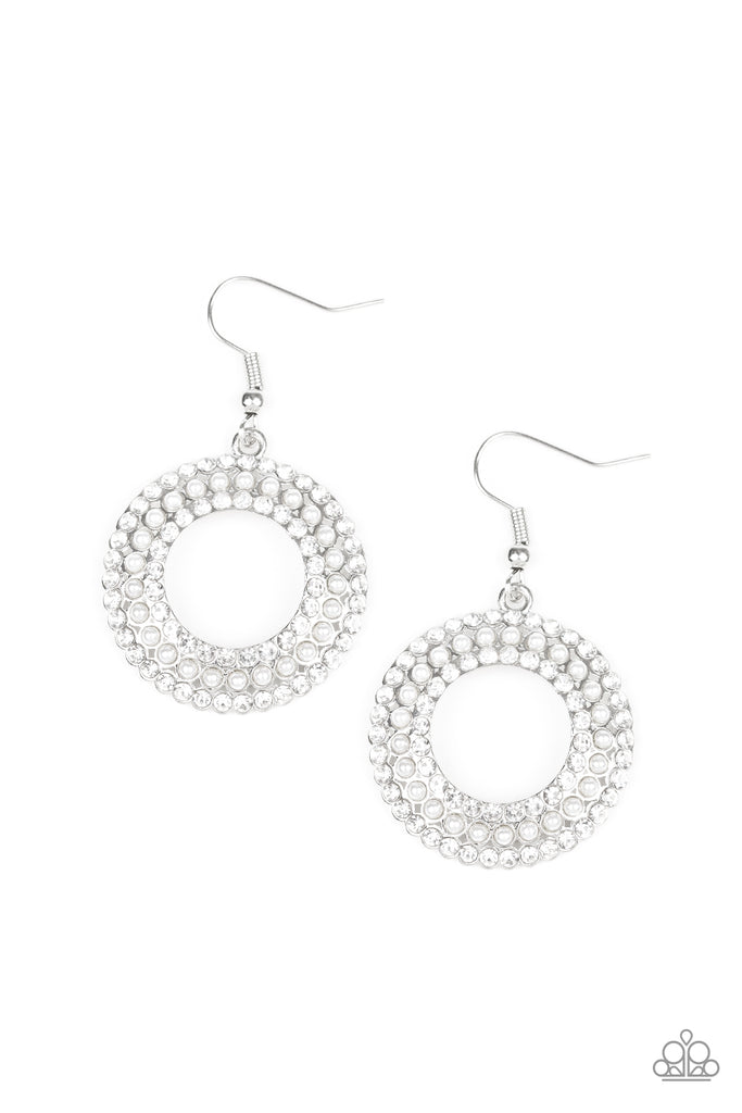 A ring of dainty white pearls is flanked by rings of glassy white rhinestones, coalescing into a timeless piece. Earring attaches to a standard fishhook fitting.  Sold as one pair of earrings.