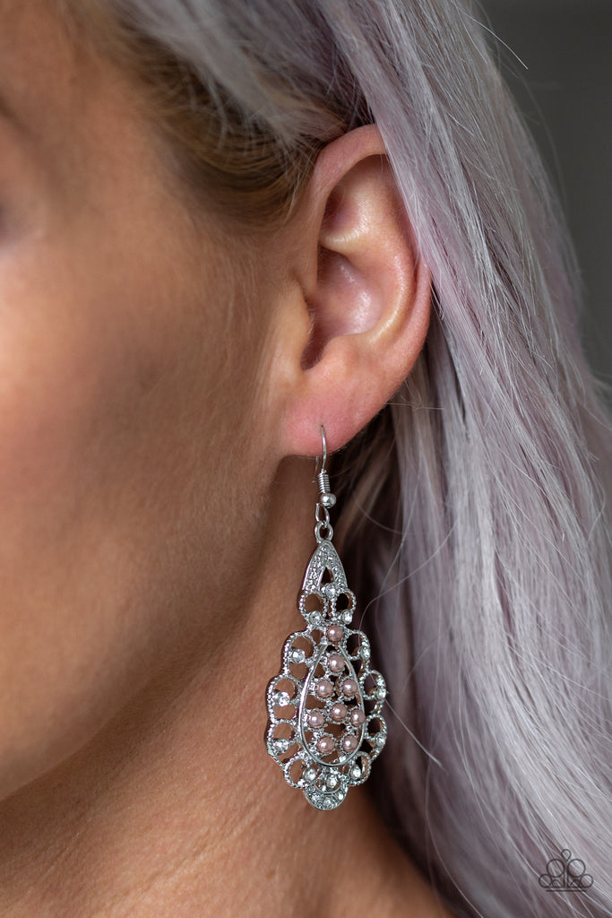 Dotted with glassy white rhinestones, elegant silver filigree curls around a brown pearl dotted center for a regal look. Earring attaches to a standard fishhook fitting.  Sold as one pair of earrings.