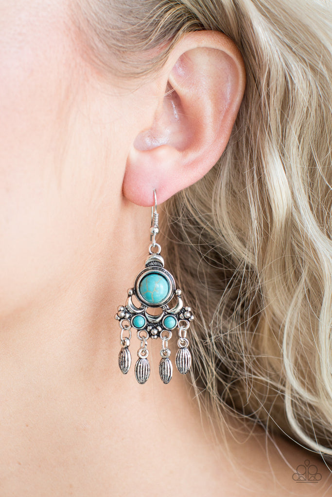 Dotted with tranquil blue stone accents, an ornate silver frame gives way to a silver beaded fringe for a seasonal look. Earring attaches to a standard fishhook fitting.  Sold as one pair of earrings.