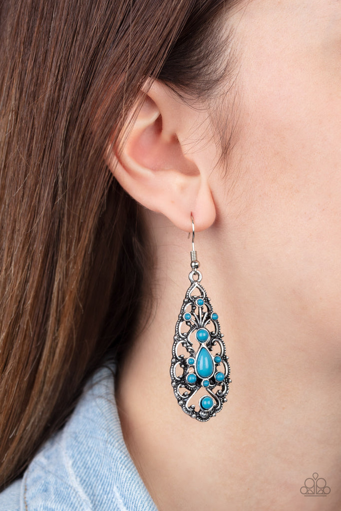A dainty collection of round and teardrop Mosaic Blue beads are encrusted along the front of a frilly silver teardrop frame for a vintage inspired look. Earring attaches to a standard fishhook fitting.  Sold as one pair of earrings.