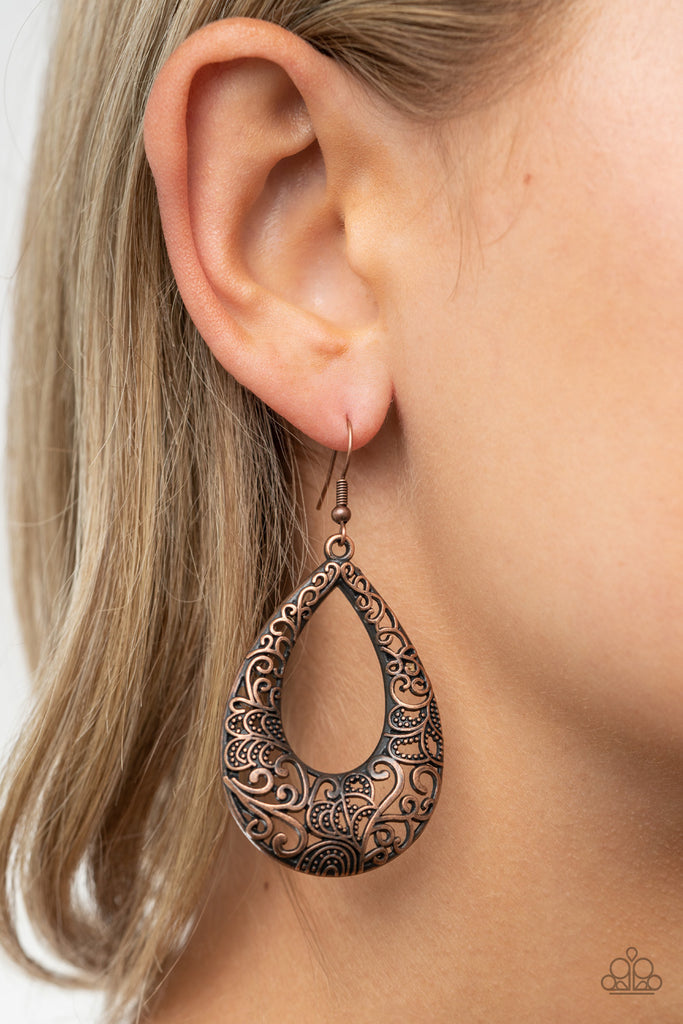 Smooth and dotted copper filigree climbs a copper teardrop, coalescing into a whimsical frame. Earring attaches to a standard fishhook fitting.  Sold as one pair of earrings.