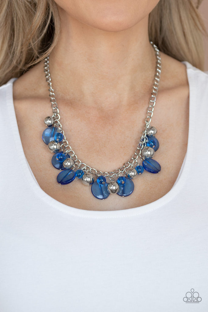 Varying in shape and shimmer, a flirtatious collection of shiny silver and glassy blue beads dance below the collar, creating a bubbly fringe. Features an adjustable clasp closure.  Sold as one individual necklace. Includes one pair of matching earrings.