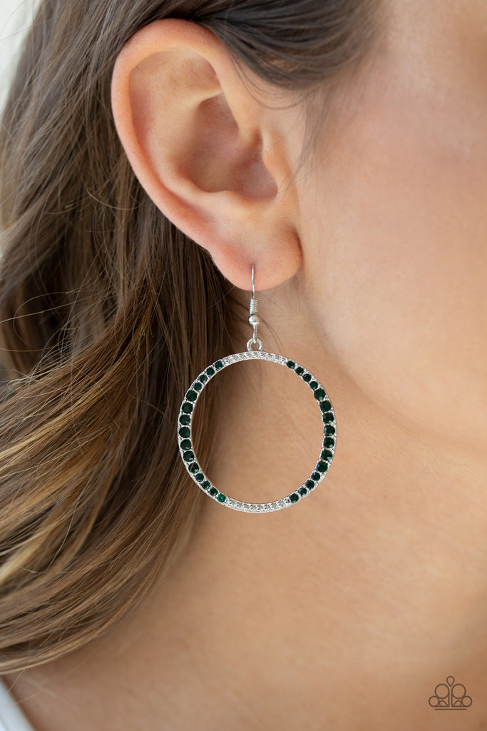 A studded silver hoop is encrusted in sections of glittery green rhinestones for a refined look. Earring attaches to a standard fishhook fitting.  Sold as one pair of earrings.