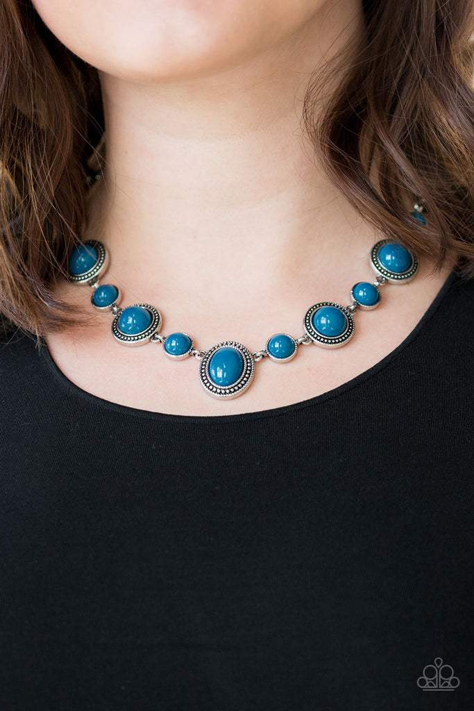 Featuring smooth and studded silver frames, tranquil blue beads link below the collar in a seasonal fashion. Features an adjustable clasp closure.  Sold as one individual necklace. Includes one pair of matching earrings.