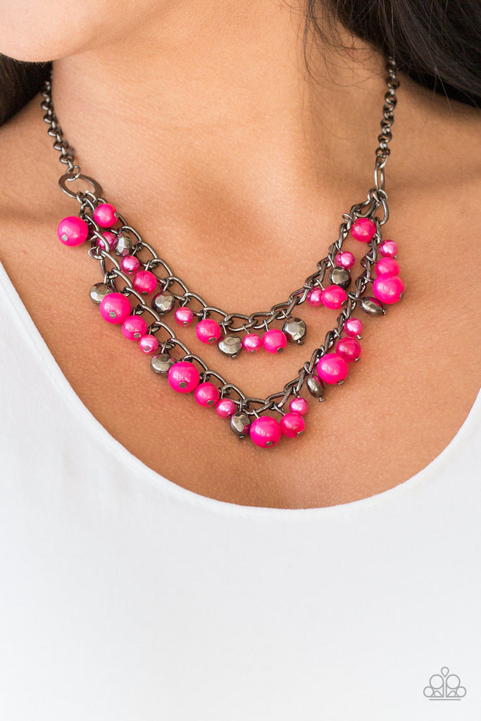 Pearly and polished pink beading joins faceted gunmetal beads along a bold gunmetal chain, creating a sassy fringe below the collar. Features an adjustable clasp closure.  Sold as one individual necklace. Includes one pair of matching earrings.