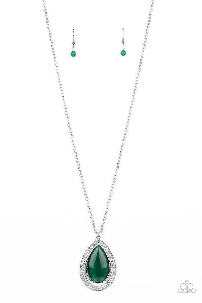 An oversized green cat's eye teardrop attaches to the top of a silver teardrop frame encrusted in glassy white rhinestones at the bottom of a lengthened silver chain, creating a glamorous pendant. Features an adjustable clasp closure.  Sold as one individual necklace. Includes one pair of matching earrings.   