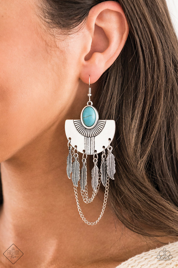 A fringe of antiqued silver feathers and shimmery silver chains dangle from the bottom of a fanning silver frame dotted in a smooth blue stone for an earthy finish. Earring attaches to a standard fishhook fitting.  Sold as one pair of earrings.
