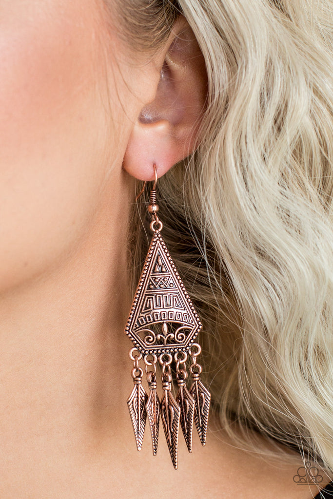Embossed in tribal inspired patterns, a triangular frame gives way to shimmery copper feather-like frames, creating a free-spirited fringe. Earring attaches to a standard fishhook fitting.  Sold as one pair of earrings.