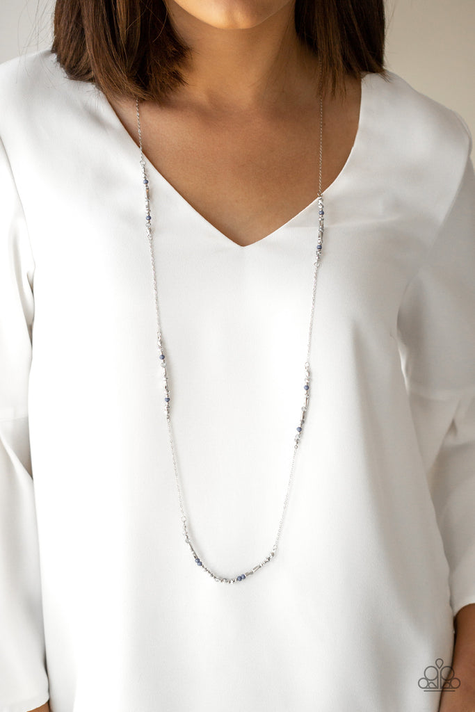 Sections of faceted blue beads, dainty silver beads, silver rectangular accents, and metallic crystal-like beads trickle along a dainty silver chain for a colorful look. Features an adjustable clasp closure.  Sold as one individual necklace. Includes one pair of matching earrings.