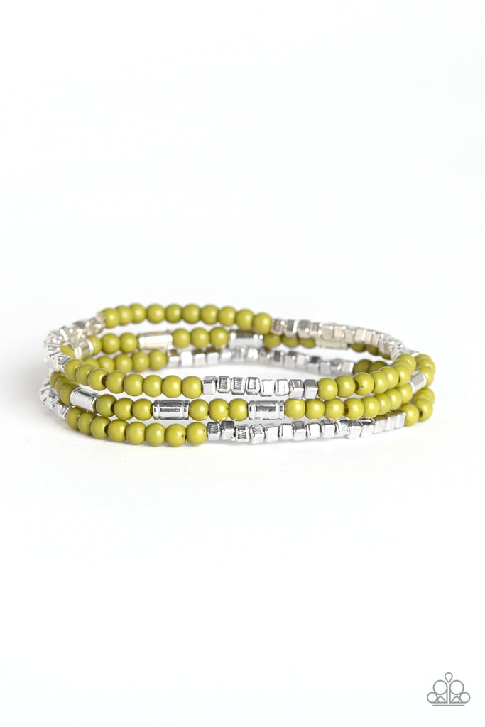 A dainty collection of Guacamole beads, shimmery silver cubes, and glistening silver accents are threaded along stretchy bands around the wrist, creating colorful layers.  Featured inside The Preview at ONE Life! Sold as one set of three bracelets.