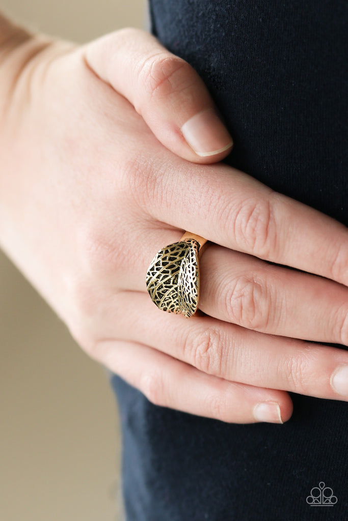 Brushed in an antiqued shimmer, a lifelike brass leaf curls across the finger in a seasonal fashion. Features a dainty stretchy band for a flexible fit.  Sold as one individual ring.