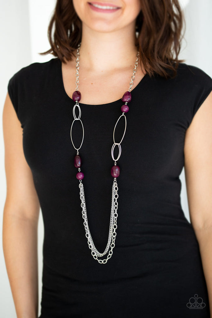 Featuring polished and cloudy faux rock finishes, Magenta Purple beads link with bold silver hoops. The whimsical compilation gives way to layers of mismatched silver chains for a seasonal finish. Features an adjustable clasp closure.  Sold as one individual necklace. Includes one pair of matching earrings.