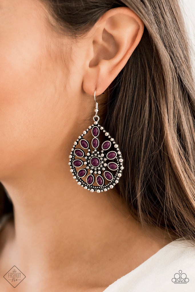 Shiny plum beads gather into a floral pattern that lays among swirls of silver filigree inside a silver teardrop, creating a whimsical frame. Earring attaches to a standard fishhook fitting.  Sold as one pair of earrings.