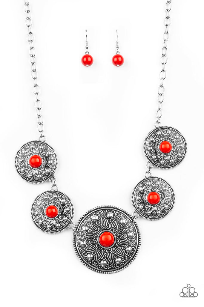 Gradually increasing in size near the center, round silver frames radiating with sunburst patterns link below the collar. Infused with shiny silver studs, the tribal inspired frames are dotted with fiery red beaded centers for a colorful finish. Features an adjustable clasp closure.  Sold as one individual necklace. Includes one pair of matching earrings.