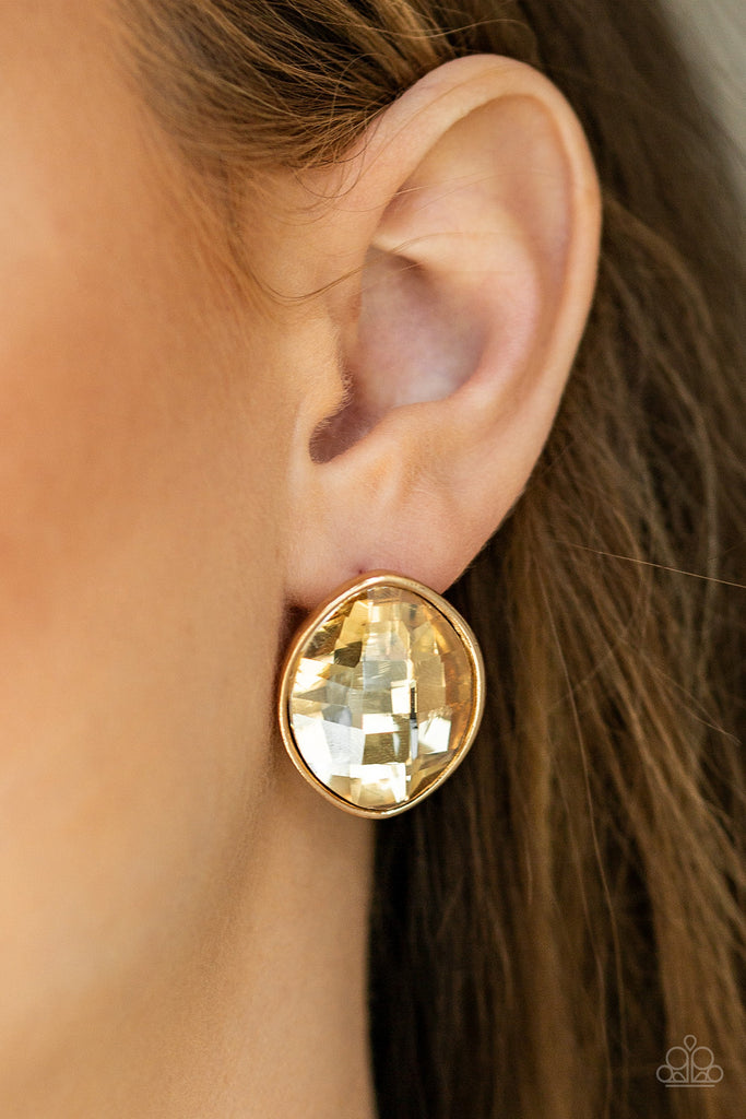 Featuring a faceted finish, an oversized marquise-shaped gem is nestled in a sleek gold frame for an undeniably statement-making look. Earring attaches to a standard post fitting.  Sold as one pair of post earrings.