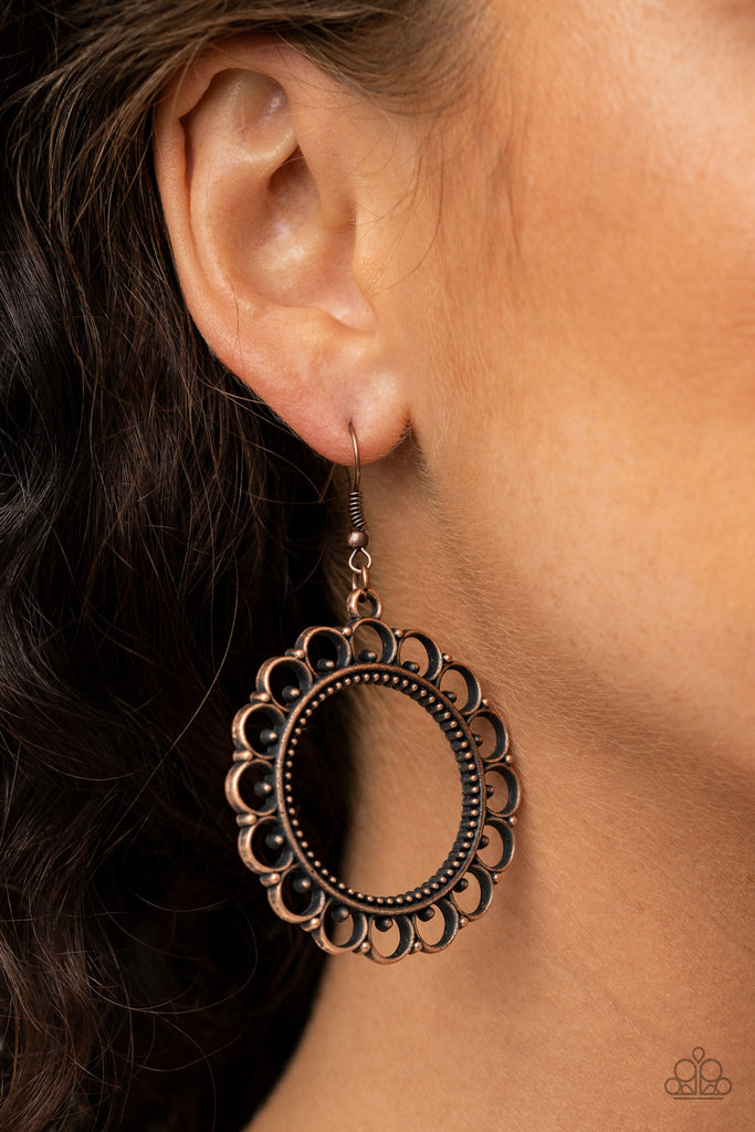 Radiating with dainty copper studs, a scalloped copper frame swings from the ear for a whimsical look. Earring attaches to a standard fishhook fitting.  Sold as one pair of earrings.
