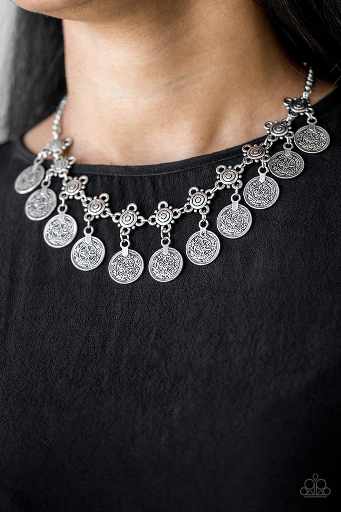 Coin-like discs swing from the bottoms of ornate silver frames, creating a boisterous fringe below the collar. Features an adjustable clasp closure.