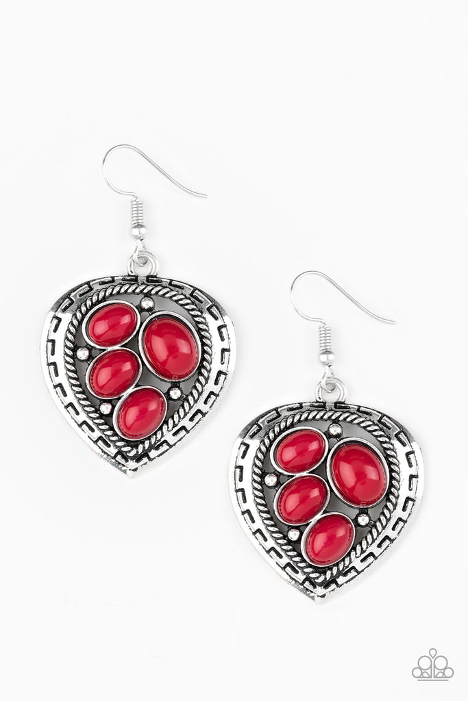Varying in size, polished red beads are sprinkled across the center of an asymmetrical heart-shaped frame for a whimsical look. Earring attaches to a standard fishhook fitting.  Sold as one pair of earrings.