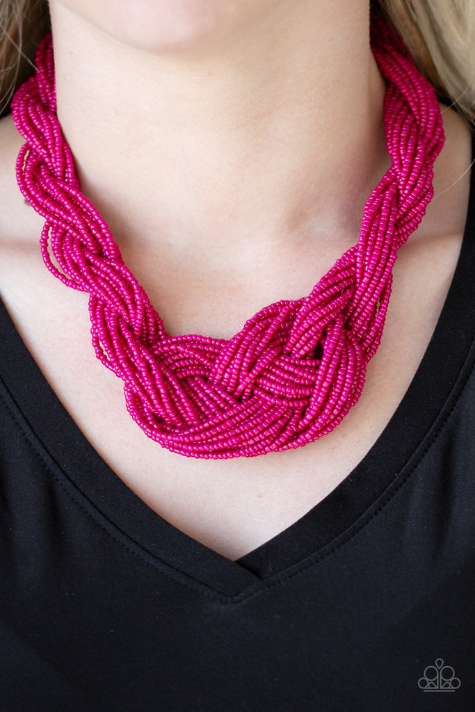 Countless strands of pink seed beads are twisted and knotted together to create an unforgettable statement piece. Features an adjustable clasp closure.  Sold as one individual necklace. Includes one pair of matching earrings.