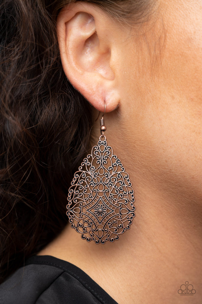 Brushed in an antiqued finish, burnished copper filigree climbs into a floral teardrop frame for a whimsically vintage look. Earring attaches to a standard fishhook fitting.  Sold as one pair of earrings.