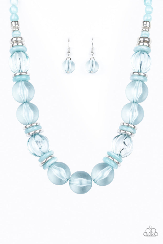 Featuring dainty silver and blue acrylic discs, a collection of oversized glassy blue beads are threaded along an invisible wire below the collar for a colorfully bubbly look. Features an adjustable clasp closure.  Sold as one individual necklace. Includes one pair of matching earrings.  *STYLE TIP- I like how this necklace looks when two are worn together.  Utlitizing the extender chain, one can be clasped at its shortest length and the other at the full extension.    Also available in ORANGE!