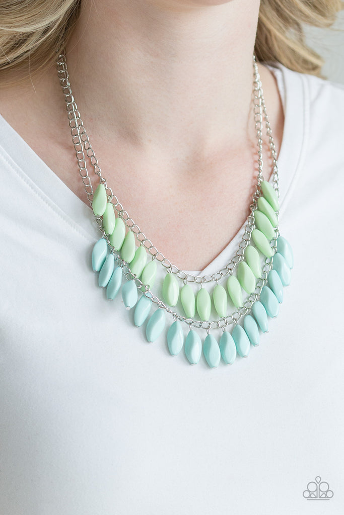 A row of faceted green beads swings above a row of faceted blue beads, creating a refreshing double fringe below the collar. Features an adjustable clasp closure.  Sold as one individual necklace. Includes one pair of matching earrings.