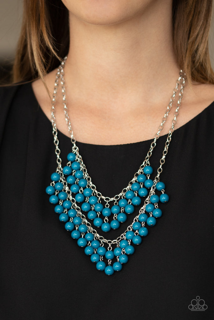 Pairs of Mosaic Blue beads cascade from the bottoms of two silver chains, creating a vivaciously layered fringe below the collar. Features an adjustable clasp closure.  Sold as one individual necklace. Includes one pair of matching earrings.