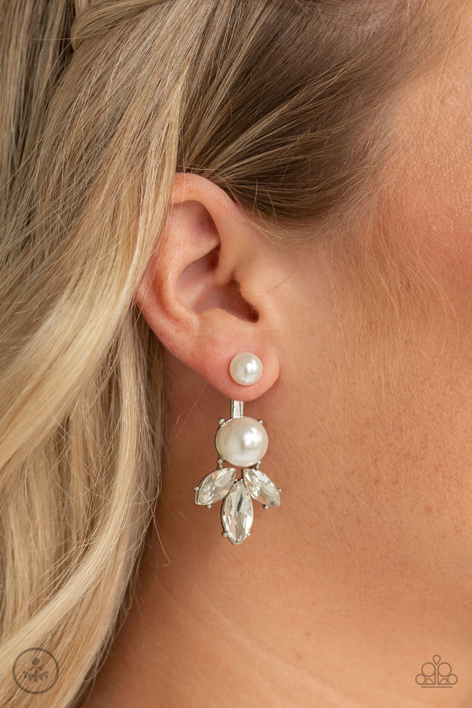 A solitaire white pearl attaches to a double-sided post, designed to fasten behind the ear. Infused with an oversized pearl and white rhinestone fringe, the double sided-post peeks out beneath the ear for a glamorous finish. Earring attaches to a standard post fitting.  Sold as one pair of double-sided post earrings.