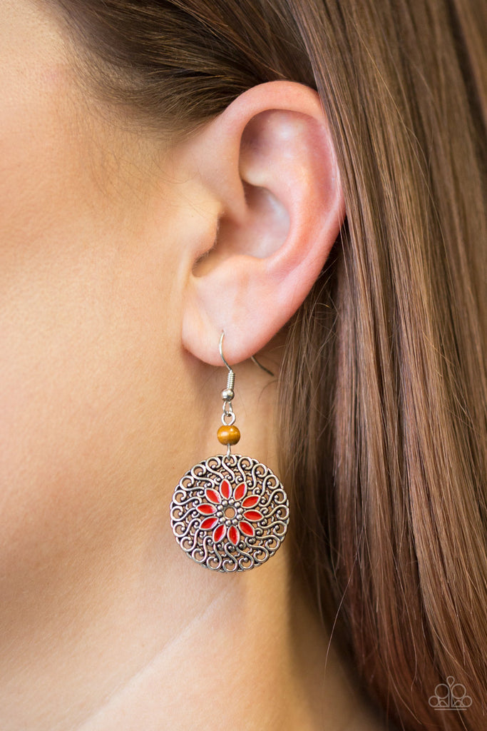 A dainty wooden bead gives way to a silver filigree filled frame radiating with red floral detail for a seasonal look. Earring attaches to a standard fishhook fitting.  Sold as one pair of earrings.
