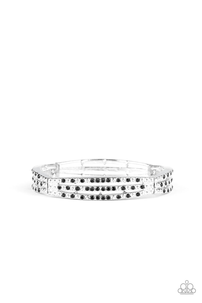 Sporadically dotted in rows of glittery black rhinestones and shiny silver studs, stacked silver frames are threaded along a stretchy band around the wrist for a refined look.  Sold as one individual bracelet.