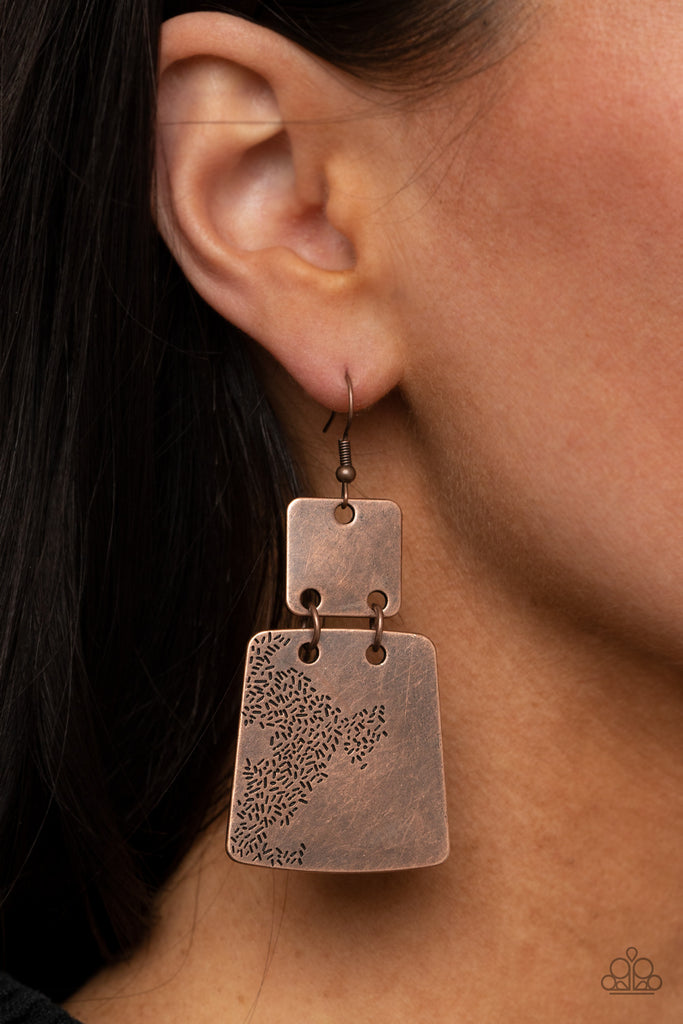 Stamped in an abstract pattern, a flared copper plate links to the bottom of a square copper frame, creating a rustic lure. Earring attaches to a standard fishhook fitting.  Sold as one pair of earrings.