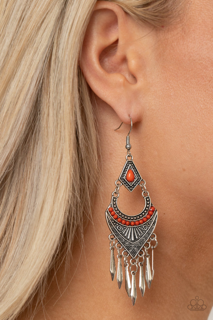 Featuring Amberglow beaded accents, mismatched studded and geometrically embossed silver frames give way to a fringe of flared silver bars for an edgy finish. Earring attaches to a standard fishhook fitting.  Sold as one pair of earrings.