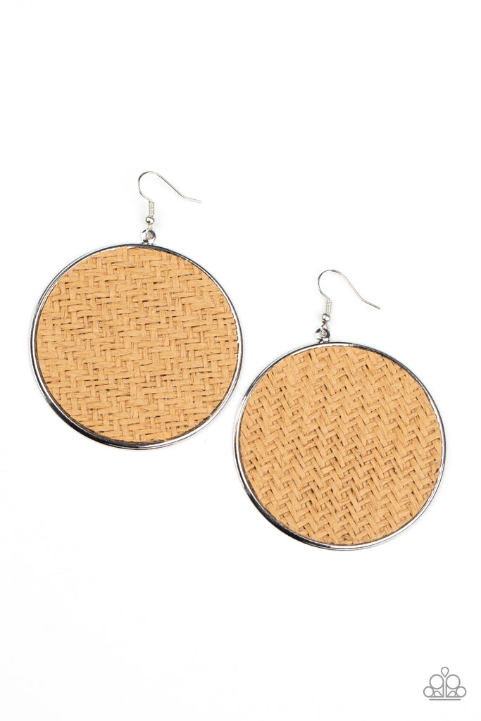 Brown twine-like cording weaves across the front of an oversized silver disc for an earthy flair. Earring attaches to a standard fishhook fitting.  Sold as one pair of earrings