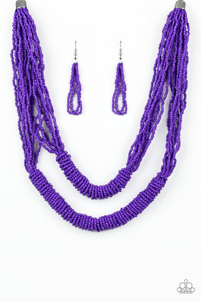 Countless layers of vivacious purple seed beads drape below the collar. Additional strands of purple seed beads wrap around the center of the layers, creating two bulky rows for a seasonal flair. Features an adjustable clasp closure.  Sold as one individual necklace. Includes one pair of matching earrings.