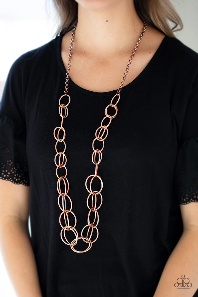 Gradually increasing in size, a collection of bold copper hoops link to a dramatically interconnected chain for a statement-making look. Features an adjustable clasp closure.  Sold as one individual necklace. Includes one pair of matching earrings.