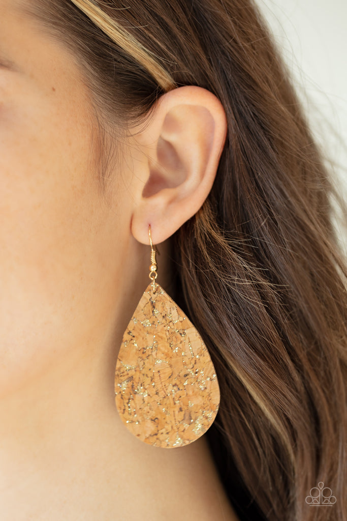 Flecked in gold, a cork-like teardrop frame swings from the ear for a seasonal look. Earring attaches to a standard fishhook fitting.  Sold as one pair of earrings.