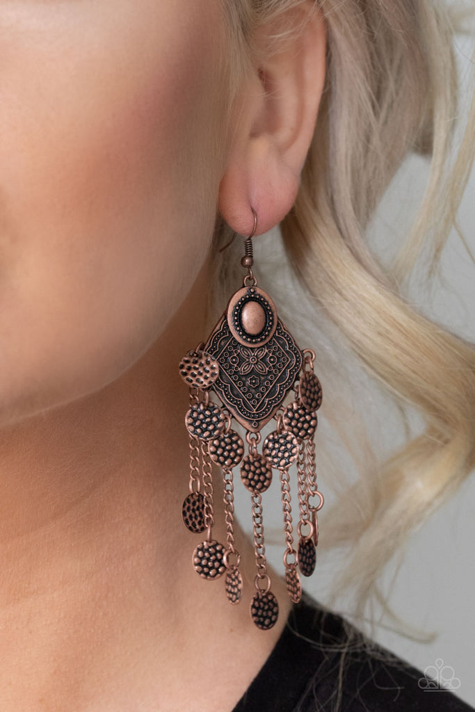Embossed in pebble-like textures, dainty copper discs swing from the bottom of a floral embossed frame and the ends of antiqued copper chains, creating a double fringe. Earring attaches to a standard fishhook fitting.  Sold as one pair of earrings.