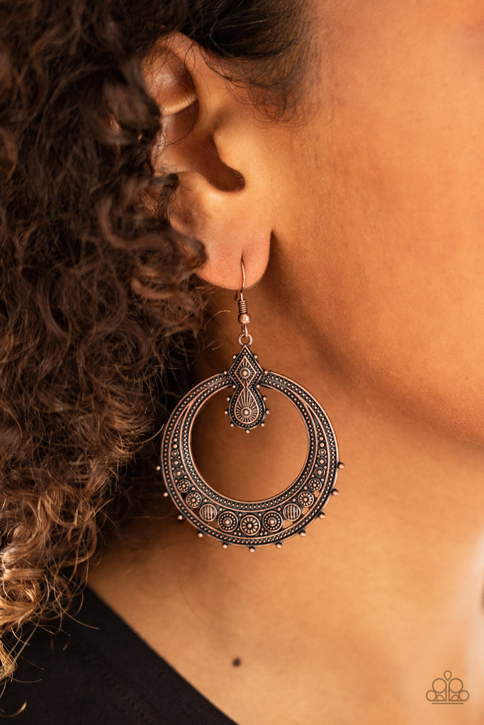 Featuring striped and floral patterns, dainty copper beads dot the bottom of a studded copper hoop that is attached to a matching ornate copper fitting for a tribal inspired look. Earring attaches to a standard fishhook fitting.  Sold as one pair of earrings.