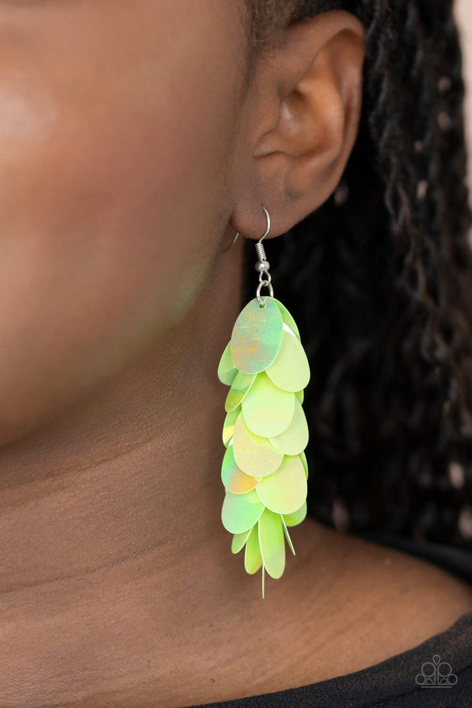 Featuring an iridescent shimmer, oversized oval green sequins cascade from the ear, creating a playful fringe. Earring attaches to a standard fishhook fitting.  Sold as one pair of earrings.