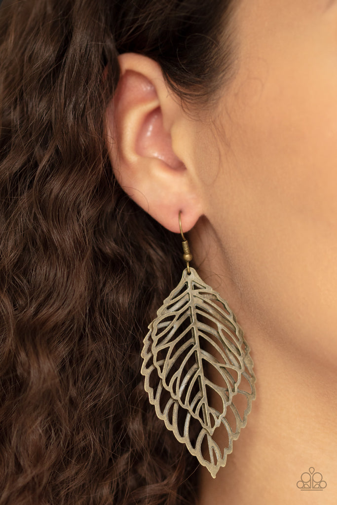 Two leafy brass frames dangle from the ear, coalescing into a seasonal lure. Earring attaches to a standard fishhook fitting.  Sold as one pair of earrings.