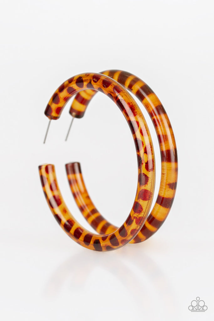 Dotted in a brown finish, an acrylic hoop curls around the ear for a retro look. Earring attaches to a standard post fitting. Hoop measures 2 1/2" in diameter.  Sold as one pair of hoop earrings.