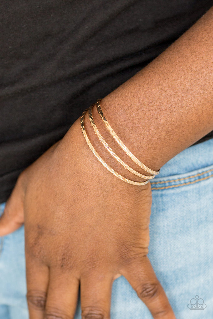 Etched in shimmery geometric patterns, glistening gold bars arc across the wrist, coalescing into a dainty cuff.  Sold as one individual bracelet.  New Kit